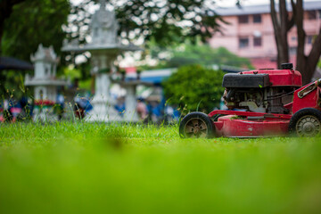 Red Lawn mower cutting grass