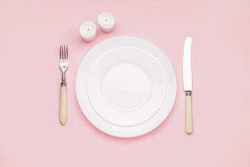 Table setting on pink background