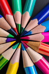 Fototapeta premium Set of colorful pencils on black background, closeup