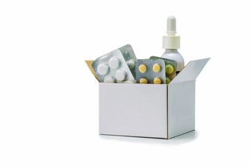 Cardboard box with different tablets and pills blister pack isolated on  white background. Medicine...