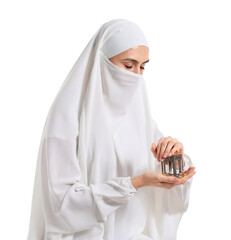 Praying Muslim woman with lantern on white background