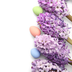 Fototapeta premium Beautiful hyacinth flowers and Easter eggs on white background