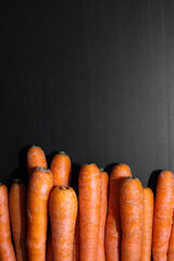 stacked carrot with space for text vertically on black table