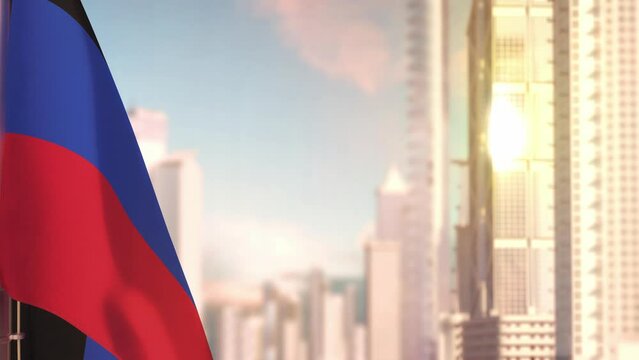 Donetsk Peoples Republic flag at sundown with modern city buildings
