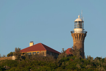 Fototapeta na wymiar lighthouse on the mountains in summer