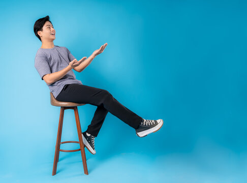 Full Body Young  Asian Posing On Blue Background