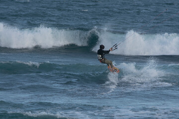 man kite surfing