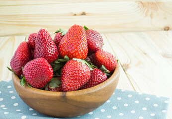 Large strawberries in a wooden bowl. Rural style. Spring pleasure. copy space. - 568302184