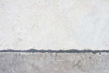 Gray concrete surface with construction joint , asphalt filler for concrete floor