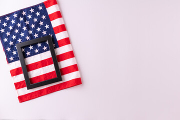 Obraz premium Happy presidents day concept with flag of the United States on white background with tulips for top view concept