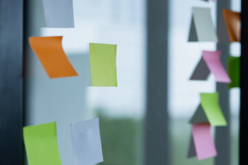 project plan using sticky papers notes on glass wall, people meeting to share idea, Business design...
