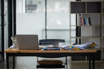 Office desk with computer, Wooden work desk with laptop and documents,