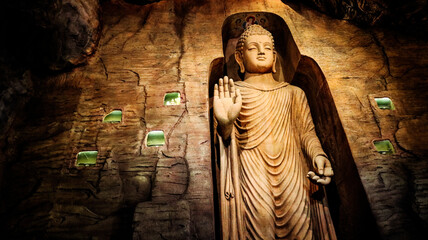 Buddha statue in Bamiyan cave on the grounds of Golden Mount Temple (Wat Saket). Landmark in...
