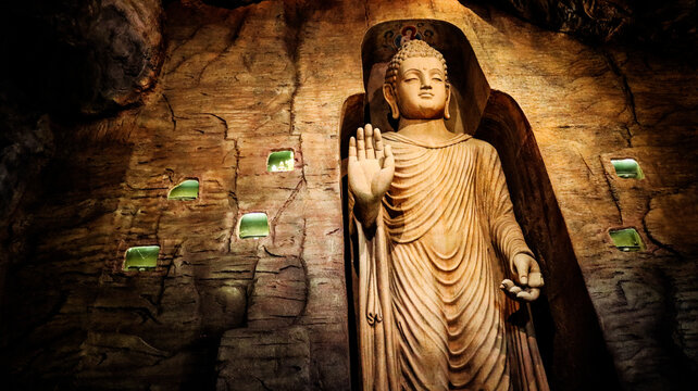 Buddha statue in Bamiyan cave on the grounds of Golden Mount Temple (Wat Saket). Landmark in Bangkok, Thailand.