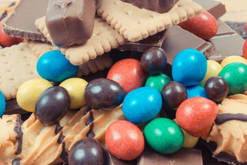 Heap of sweets containing a lot of sugar. Unhealthy eating