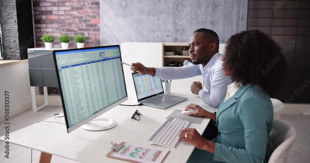 Poster analyst employee working on spreadsheet