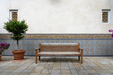 An empty bench in the Moroccan garden.