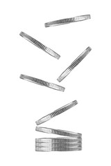 falling into a stack of coins isolated from the background, the concept of business success and investment, net profit