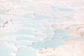 Emerald water in white limestone rock.