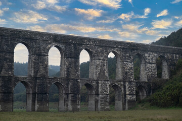 historical aqueduct in cloudy weather, aqueduct architecture during the ottoman empire.