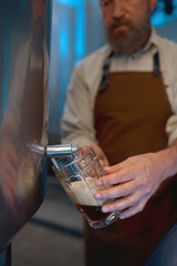Brewery master quality tasting of craft beer at production facility