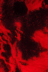 Splash of red powder on black marble background with a grunge texture. Generative AI