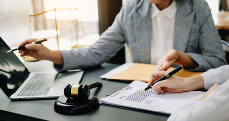 Business Asian and Female lawyer or judge consult having team meeting with client, Law and Legal services concept.Customer service good cooperation