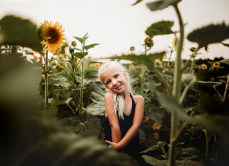 young girl in sunflower field