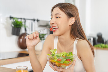 Diet, Dieting happy pretty asian young woman, girl hand using fork at tomato on mix vegetables,...