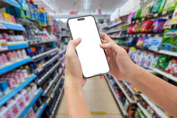 Use a smartphone with blank screen on super store background.