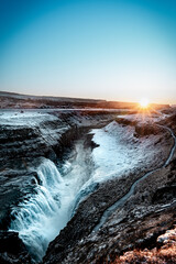 Iceland Gullfoss powerfull waterfall river in winter sunset or sunrise 