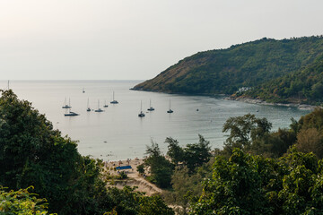 Naklejka premium Naiharn beach Naiharn beach Phuket, Promthep cape Phuket, Rawai beach Phuket with beautiful blues and greenery island oceans mountains boats trees in beautiful resort island Phuket Thai