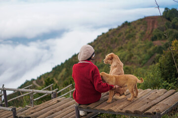 A solo Traveler enjoying the Cloud hunting with puppys in Ta Xua, Son La in Northern Vietnam