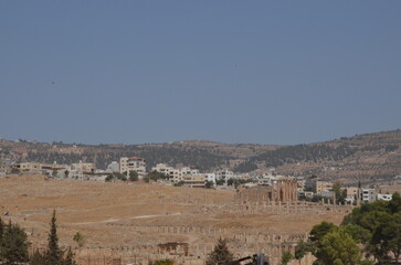 Sunny temples, arches, the Nymphaeum, stone ornaments, columns and column bases on the ruins of the...