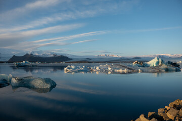 Iceland Jökulsárlón glacier lagoon lake with cloudy blue sky and ice floe