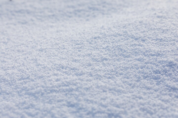 Close-up macro photo of graupel snow, also called soft hail, hominy snow, or snow pellet.