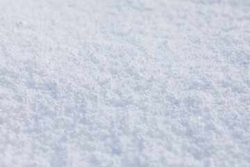 Close-up macro photo of graupel snow, also called soft hail, hominy snow, or snow pellet.