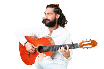 Obraz premium Young man with beard with guitar over isolated chroma key background