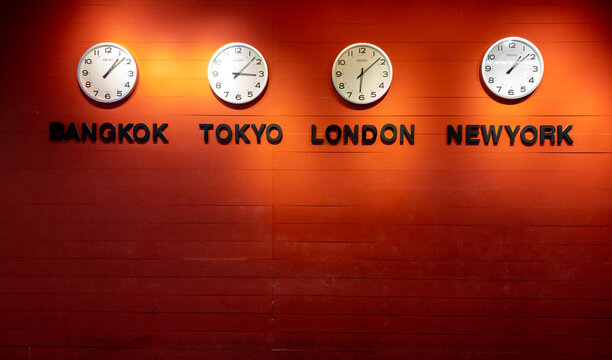 difference clock time zone in multi metropolis ; difference country on wood background