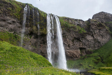 waterfall in the mountains in iceland