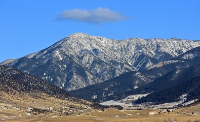 scenic winter landscape on a sunny day  at mallard's rest fishing access along the paradise valley scenic loop of the yellowstone river and gallatin range, south of livingston, montana