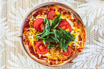 healthy plant-based food, vegan margherita pizza with fresh tomatoes and basil