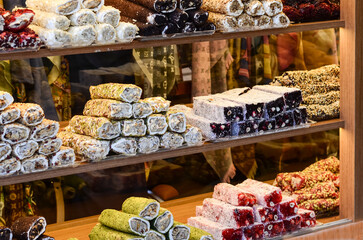 Turkish sweets lie behind glass in a Turkish store