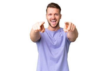 Fototapeta premium Young handsome caucasian man over isolated chroma key background surprised and pointing front