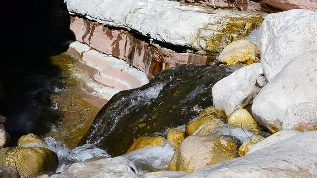 Water flows along the Brent de l'art in the province of Belluno Italy