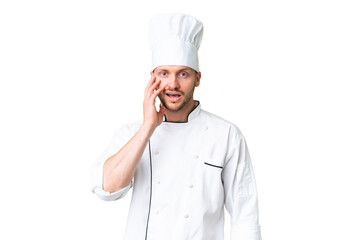 Young caucasian chef over isolated chroma key background with surprise and shocked facial expression