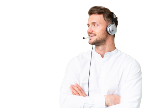 Telemarketer caucasian man working with a headset over isolated chroma key background happy and smiling