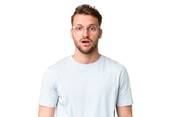 Young handsome caucasian man over isolated chroma key background With glasses and surprised expression