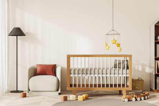 Beige baby room interior with crib, armchair and toys decoration