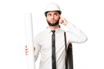 Young architect man with helmet and holding blueprints over isolated chroma key background having doubts and thinking